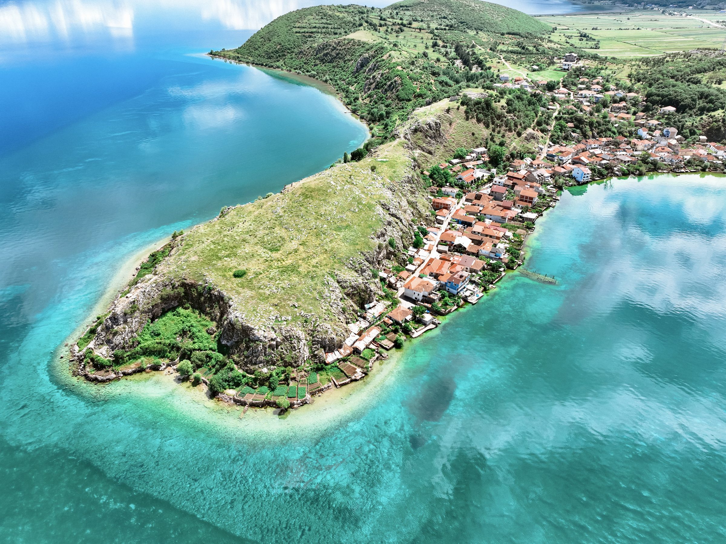 Aerial view of the Lin peninsula on Lake Ohrid, turquoise water on both sides